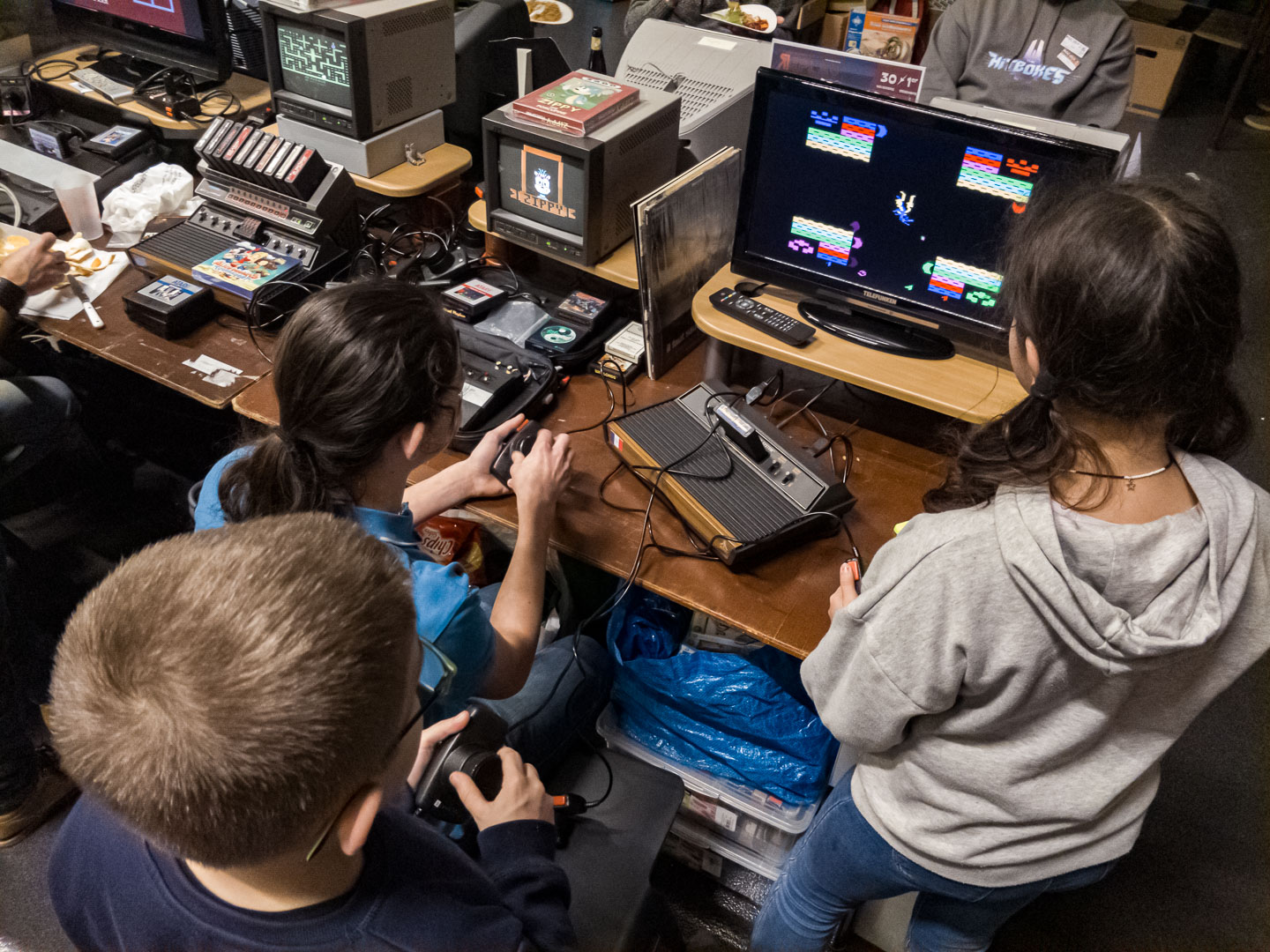 Kids having fun on an Atari 2600